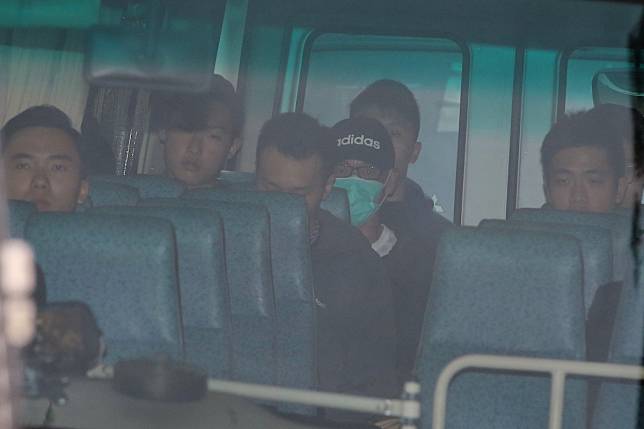 Kwai Ping-Hung, pictured wearing a hat and face mask, has been released and is to be deported to the US. Photo: Dickson Lee