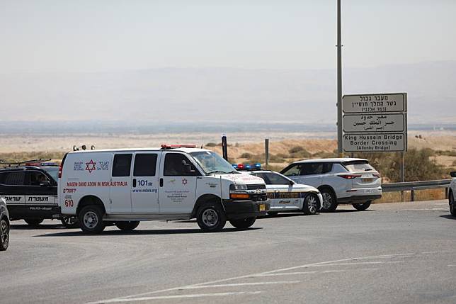 Police cars and an ambulance are pictured near the Allenby Bridge, a key crossing point between the Israeli-occupied West Bank and Jordan, after a shooting attack on Sept. 8, 2024. A gunman opened fire on Sunday at the Allenby Bridge, killing three people before being shot dead by Israeli forces, Israeli officials said. (Photo by Jamal Awad/Xinhua)