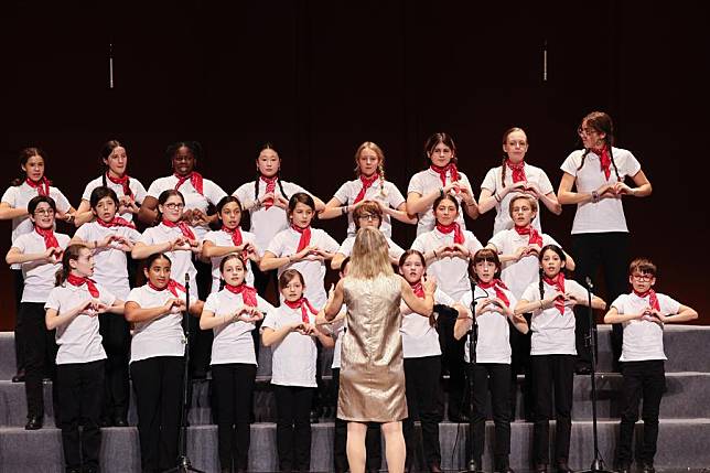 A children's chorus from Paris performs during a Sino-French children's chorus festival held at Hainan Song and Dance Theater in Haikou, south China's Hainan Province, Oct. 25, 2024. (Xinhua/Zhang Liyun)