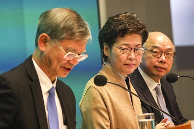 Hong Kong Chief Executive Carrie Lam tackles questions on the HK$10 billion welfare package alongside Secretary for Labour and Welfare Law Chi-kwong (left) and Secretary for Transport and Housing Frank Chan Fan on Tuesday. Photo: Felix Wong