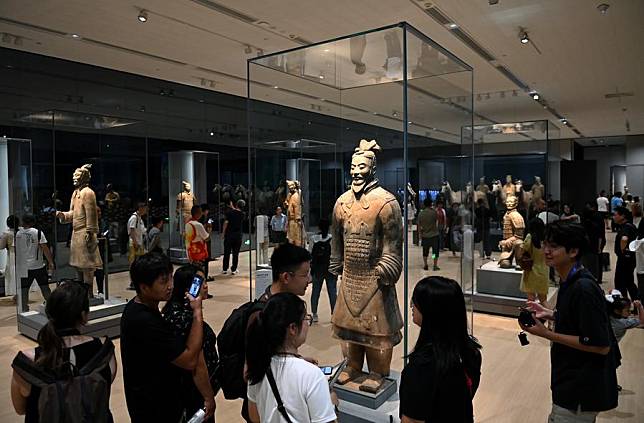 People visit an exhibition, commemorating the 50th anniversary of the discovery and excavation of the iconic Terracotta Warriors, at the Emperor Qinshihuang's Mausoleum Site Museum in Xi'an, capital of northwest China's Shaanxi Province, Sept. 8, 2024. (Xinhua/Li Yibo)