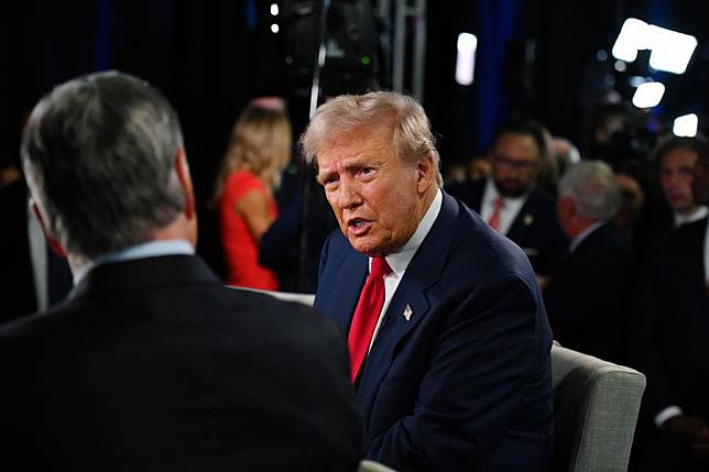 Former U.S. President Donald Trump &copy; is interviewed at the U.S. presidential debate spin room after the first presidential debate with U.S. Vice President Kamala Harris in Philadelphia, the United States, on Sept. 10, 2024. (Xinhua/Li Rui)