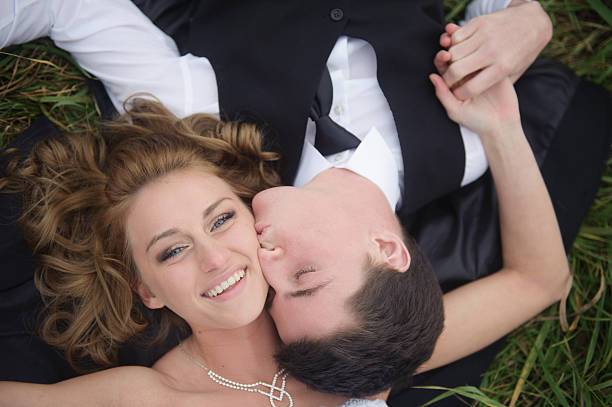 A handsome groom with his beautiful wife on their wedding day.