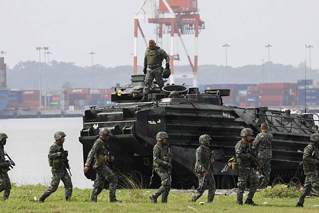 The Philippine Marines showcased this weekend its eight brand new amphibious assault vehicles in drills simulating ‘a scenario of an island retake’. Photo: EPA