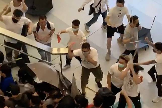 White-clad men attack travellers and passers-by at Yuen Long station on July 21. Photo: SCMP Pictures