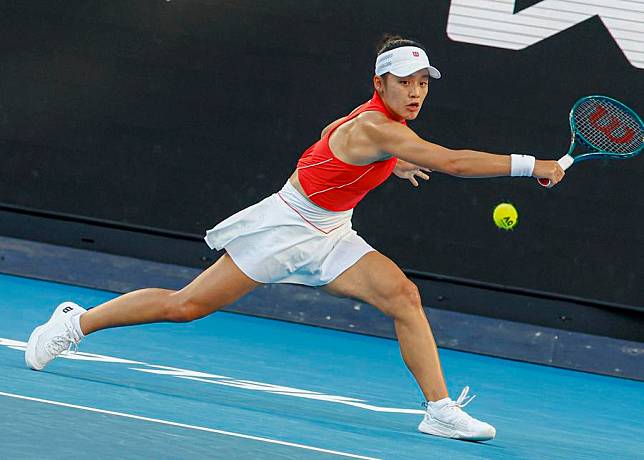 China's Wei Sijia hits a return during the women's singles first-round match against Italy's Jasmine Paolini at the Australian Open in Melbourne, Australia, on Jan. 14, 2025. (Photo by Chu Chen/Xinhua)