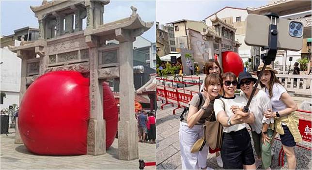 台南「紅球」卡在接官亭中的一幕雖俏皮，但也有人擔心破壞古蹟。翻攝自黃偉哲臉書