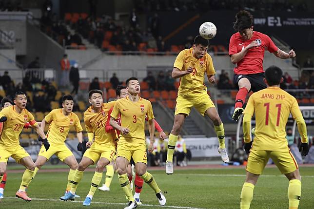 South Korea's Kim Min-jae rises high to score the only goal of the match against China in Busan. Photo: AP