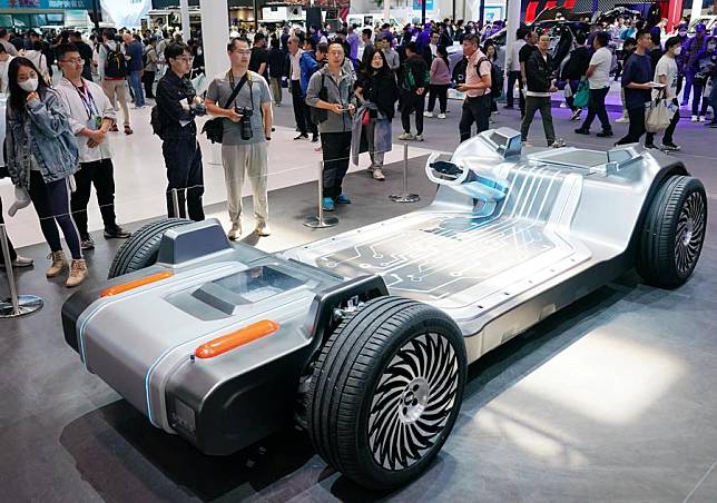 Visitors watch an AI digital chassis of Geely at the 2024 Beijing International Automotive Exhibition in Beijing, China, April 30, 2024. (Xinhua/Zhang Chenlin)