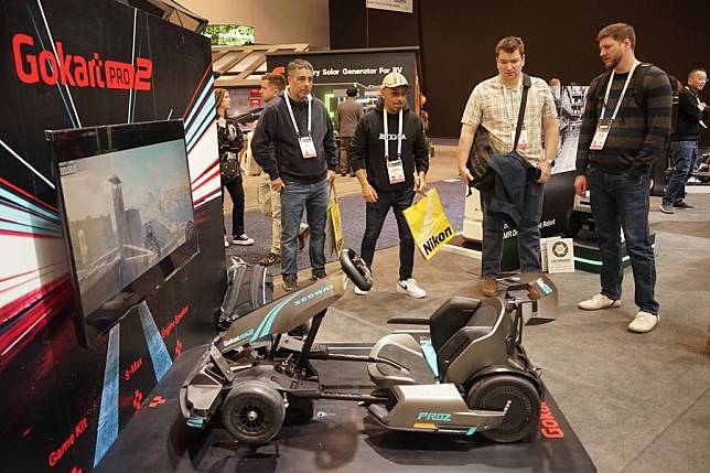 People visit the exhibition area of Segway during the 2024 Consumer Electronics Show (CES) in Las Vegas, the United States, Jan. 11, 2024. (Photo by Zeng Hui/Xinhua)