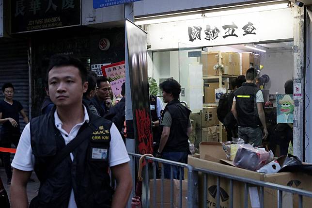 Police outside National Disaster Hardware shop on Saturday. Photo: Edmond So