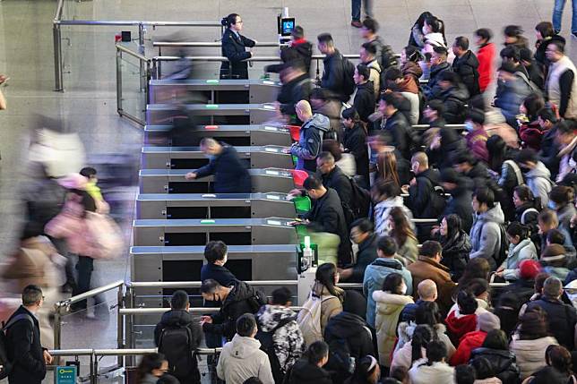 Passengers have their tickets checked before boarding trains at the Chengdu East Railway Station in Chengdu, southwest China's Sichuan Province, Jan. 14, 2025. (Xinhua/Wang Xi)