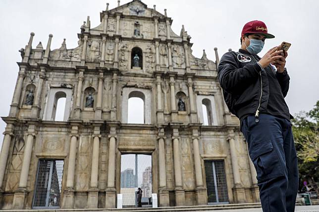 A man wearing a mask at the Ruins of St Paul's in Macau. Photo: Winson Wong