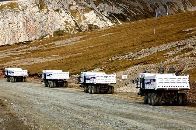 This undated handout photo shows hybrid autonomous trucks at the Yulong Copper Mine in Qamdo, southwest China's Xizang Autonomous Region. (Western Mining Co., Ltd./Handout via Xinhua)