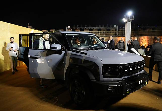 Visitors try a new car at the launching ceremony of Jetour Auto's first off-road SUV model T2 in Cairo, Egypt, Nov. 4, 2024. (Xinhua/Wang Dongzhen)