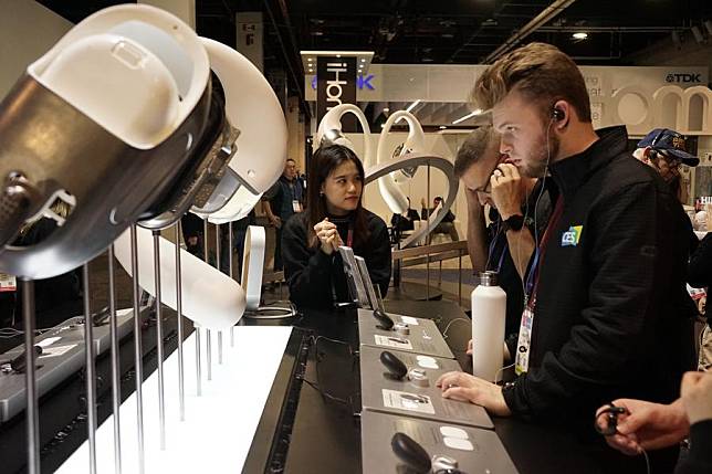 People visit the exhibition area of Chinese company Shokz during the Consumer Electronics Show (CES) 2025 in Las Vegas, the United States, Jan. 7, 2025. (Photo by Zeng Hui/Xinhua)