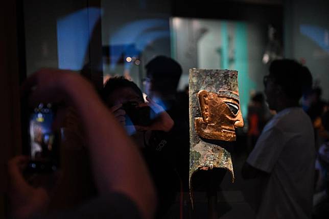 Visitors take photos of an exhibit during an exhibition named &ldquo;Unveiling Sanxingdui and Jinsha of Ancient Shu Civilization&rdquo; at the Grand Canal Museum of Beijing, in Beijing, capital of China, June 27, 2024. With a total of 265 pieces of relics featuring ancient Shu civilization, the exhibition kicked off here on Thursday and will last until Oct. 10. (Xinhua/Chen Zhonghao)