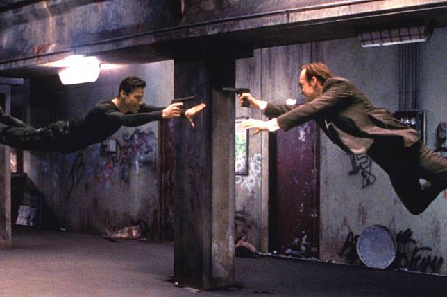 Keanu Reeves (left) and Hugo Weaving star in a scene from The Matrix that used physical wire work techniques created by Hong Kong martial arts director Yuen Woo-ping. Photo: Reuters