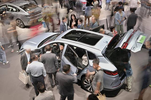 Visitors view a vehicle of Song PLUS by Chinese NEV manufacturer BYD during the 2024 Beijing International Automotive Exhibition in Beijing, capital of China, May 4, 2024. (Xinhua/Yin Dongxun)