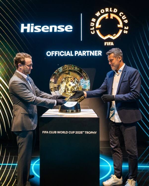 David Gold, Vice President of Hisense International and President of Hisense Americas and Aldo Kafie, Head of FIFA Partnership Management, unveil the FIFA Club World Cup 2025™ Trophy at CES