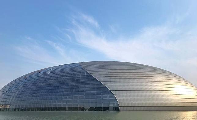 Mobile photo shows workers cleaning the exterior of the National Centre for the Performing Arts in Beijing, capital of China, Sept. 17, 2019. (Xinhua/Liu Hui)