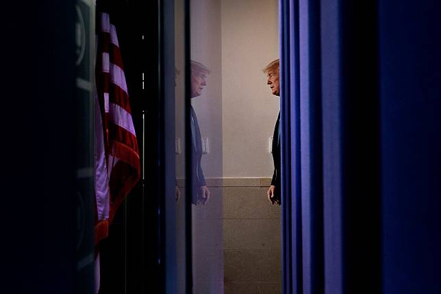 US President Donald Trump arrives for the daily briefing on the novel coronavirus at the White House in Washington on March 21. Photo: AFP