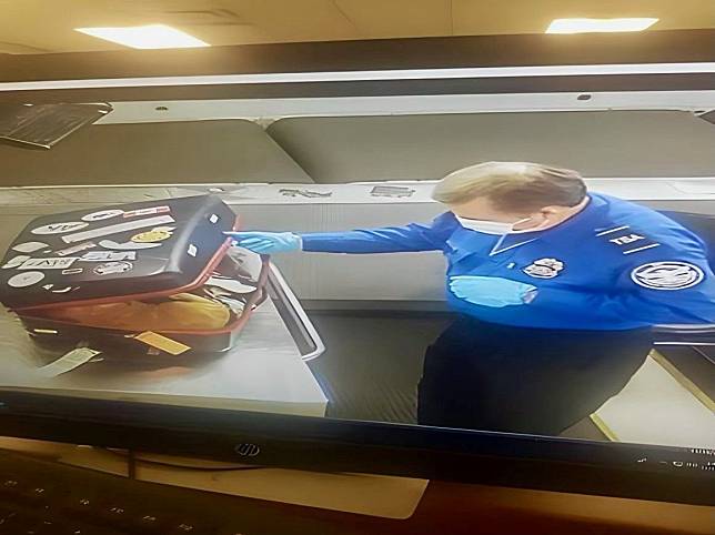 一名美國紐約甘迺迪國際機場官員，以X光檢查行李時，發現有一隻橘貓在行李箱內。（翻攝自美國運輸安全管理局（TSA）推特）
