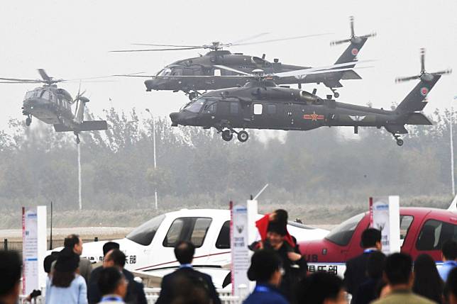 New Z-20 helicopters from the PLA Air Force perform during the China Helicopter Exposition in Tianjin. Photo: Reuters