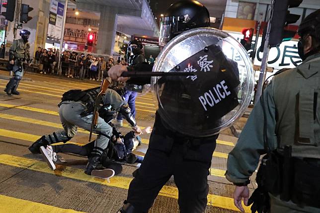 Anti-government protesters clash with riot police outside Prince Edward MTR station in December last year. Photo: Edmond So