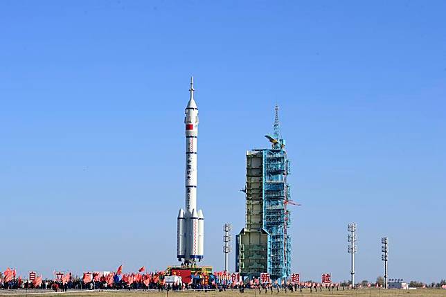 This photo taken on Oct. 22, 2024 shows the combination of the Shenzhou-19 crewed spaceship and a Long March-2F carrier rocket being transferred to the launch area. The combination has been transferred to the launch area, the China Manned Space Agency (CMSA) said on Tuesday. (Photo by Wang Jiangbo/Xinhua)