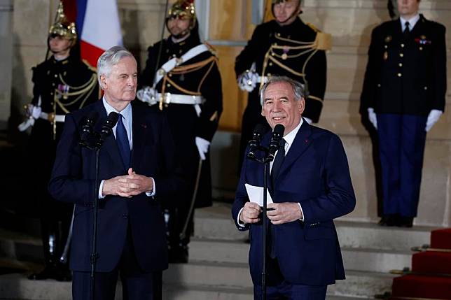 Francois Bayrou (R, Front) and outgoing French Prime Minister Michel Barnier (L, Front) attend the transfer of power ceremony in Paris, France, on Dec. 13, 2024. French President Emmanuel Macron on Friday nominated Francois Bayrou as the country's new prime minister, succeeding Michel Barnier, who was ousted in a vote of no confidence on Dec. 4. (Photo by Henri Szwarc/Xinhua)