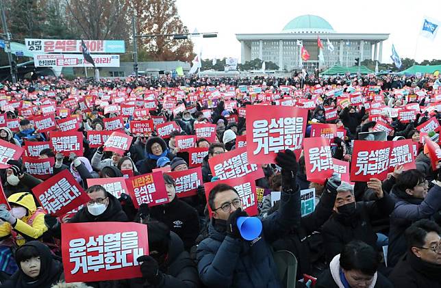 People attend a rally to call for the impeachment of South Korean President Yoon Suk-yeol near the National Assembly in Seoul, South Korea, Dec. 7, 2024. (Xinhua/Yao Qilin)