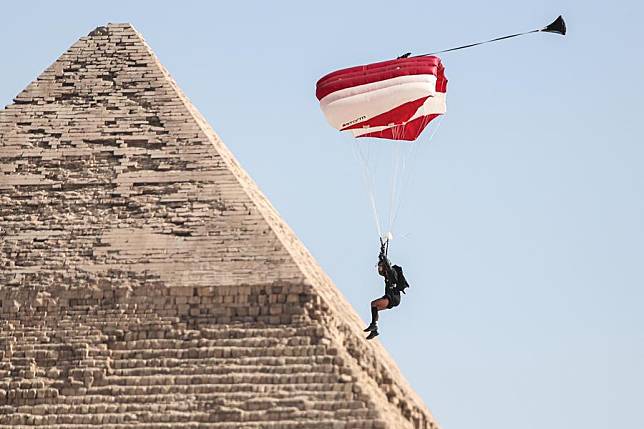 A skydiver flies by a pyramid during the skydiving festival &ldquo;Jump Like a Pharaoh&rdquo; at Giza Pyramids scenic spot in Giza, Egypt, on Oct. 29, 2024. (Xinhua/Ahmed Gomaa)