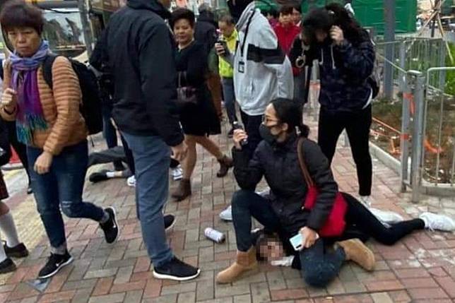 An online photo of a masked policewoman in plain clothes sitting on a 14-year-old schoolgirl has gone viral. Photo: Facebook