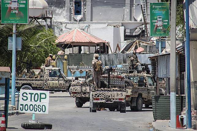 Security forces block a road leading to SYL Hotel in Mogadishu, Somalia, on March 15, 2024. At least three soldiers were killed and 27 others wounded in a terrorist attack at a popular hotel in the Somali capital of Mogadishu on March 14. (Photo by Hassan Bashi/Xinhua)