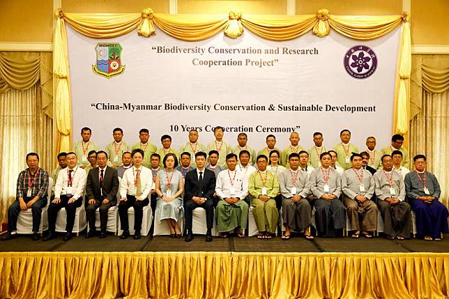 Participants pose for a group photo during a ceremony celebrating a decade of collaboration in biodiversity conservation and sustainable development between China and Myanmar, in Nay Pyi Taw, Myanmar, Oct. 29, 2024. (Photo by Myo Kyaw Soe/Xinhua)