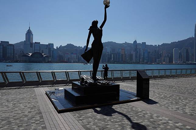 A lone tourist on Hong Kong’s popular attraction, the Avenue of Stars in Tsim Sha Tsui. Photo: Robert Ng