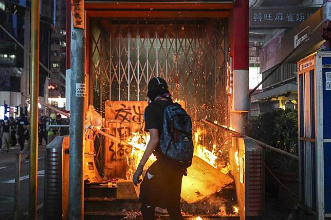 Anti-government protesters set fire to an entrance of Mong Kok station on October 5. Photo: Edmond So