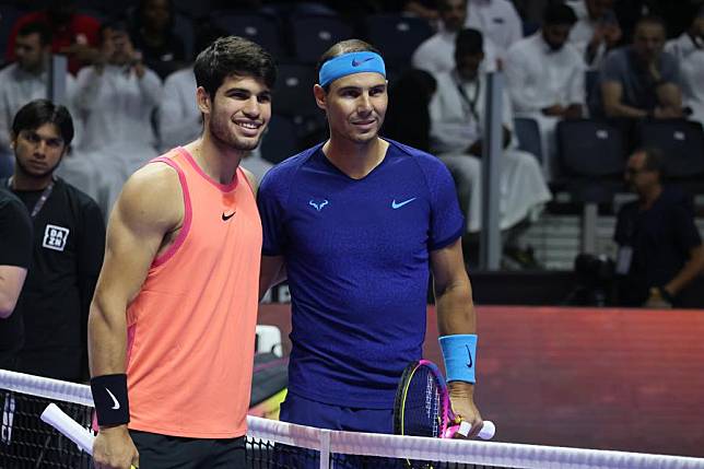 Carlos Alcaraz (L) of Spain and his compatriot Rafael Nadal pose for photos ahead of their semifinal match at the Six Kings Slam exhibition tennis tournament in Riyadh, Saudi Arabia, Oct. 17, 2024. (Xinhua/Wang Haizhou)