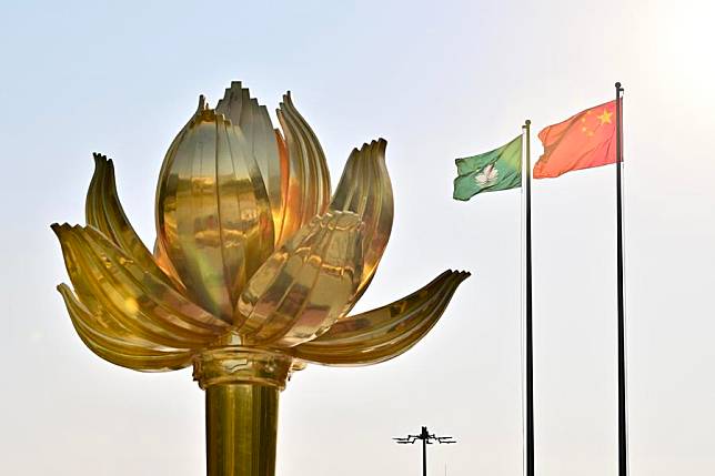 A flag-raising ceremony marking the 25th anniversary of Macao's return to the motherland is held at the Golden Lotus Square in Macao, south China, Dec. 20, 2024. (Xinhua/Zhu Wei)