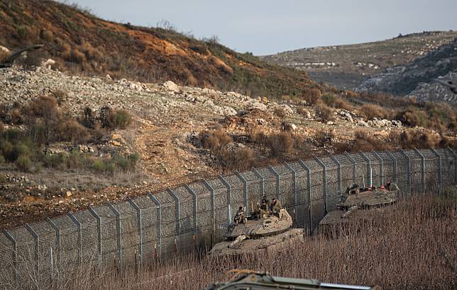 Israeli troops are seen near the buffer zone fence on the eastern side of the Golan Heights, on Dec. 10, 2024. (Xinhua/Chen Junqing)