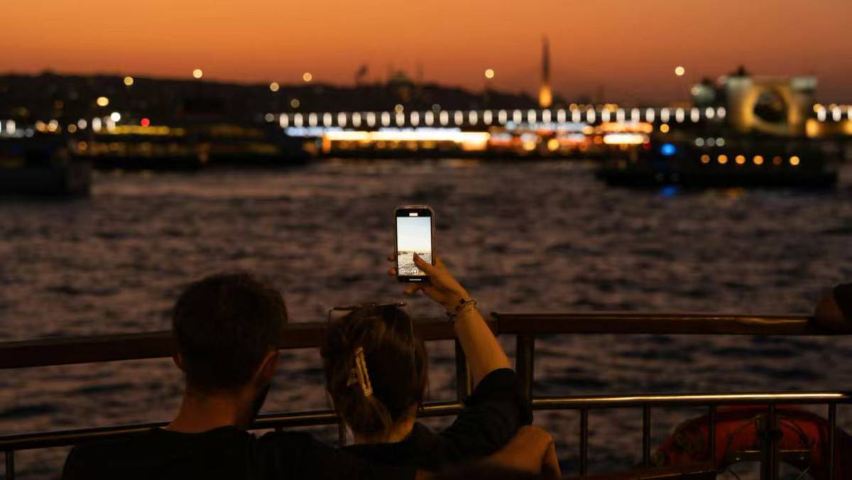 Couple enjoying a sunset cruise