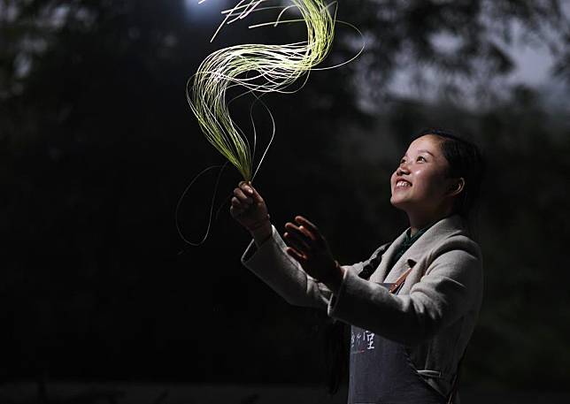 Bamboo weaving craftswoman Yang Changqin displays the newly-made bamboo threads at the training center established by her in Minzu Village of Datong Township in Chishui, southwest China's Guizhou Province, Nov. 11, 2019. (Xinhua/Yang Wenbin)