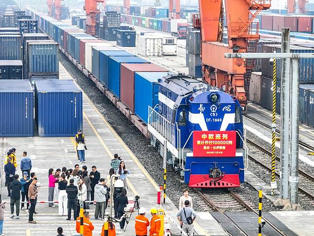 A drone photo taken on Nov. 15, 2024 shows the 100,000th China-Europe freight train, coded X8083, waiting for departure at the Tuanjiecun Station in Chongqing, southwest China. (Xinhua/Tang Yi)