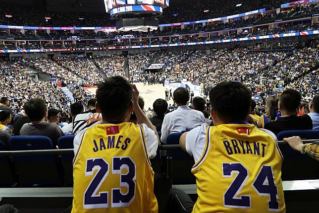 Los Angeles Lakers fans in LeBron James and Kobe Bryant jerseys watch the NBA China Games 2019 in Shanghai. Photo: Reuters
