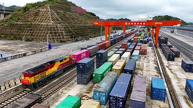 An aerial drone photo taken on Nov. 19, 2024 shows a train loaded with lithium batteries for traction purposes at Dulaying international land-sea logistics port in Guiyang, southwest China's Guizhou Province. (Xinhua/Liu Xu)