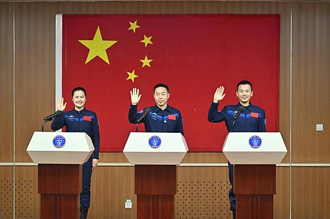 Chinese astronauts Cai Xuzhe &copy;, Song Lingdong &reg; and Wang Haoze, who will carry out the Shenzhou-19 spaceflight mission, meet the press at the Jiuquan Satellite Launch Center in northwest China, Oct. 29, 2024. (Xinhua/Li Xin)