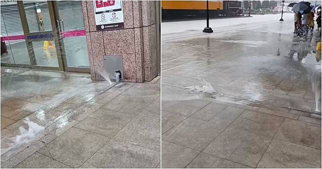 上午暴雨造成台北車站外出現「噴泉」。