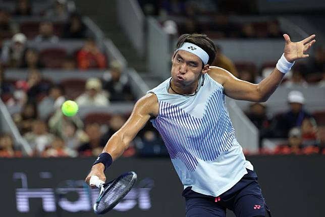 Chinese player Buyunchaokete in action during the men's singles semifinal against Jannik Sinner of Italy at the China Open in Beijing, China on Oct. 1, 2024. (Xinhua/Bai Xuefei)