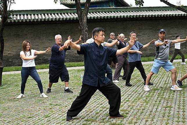 Members of a delegation of over 10 Los Angeles-based travel agents learn Tai Chi in Beijing, capital of China, Sept. 10, 2024. (Xinhua/Zhao Chenjie)